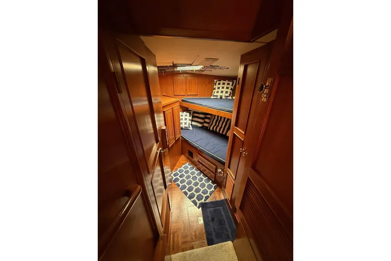 Slide: The Image of Interior of 1989 Jefferson Marquessa 52 yacht with cozy wooden bunk beds. - 17