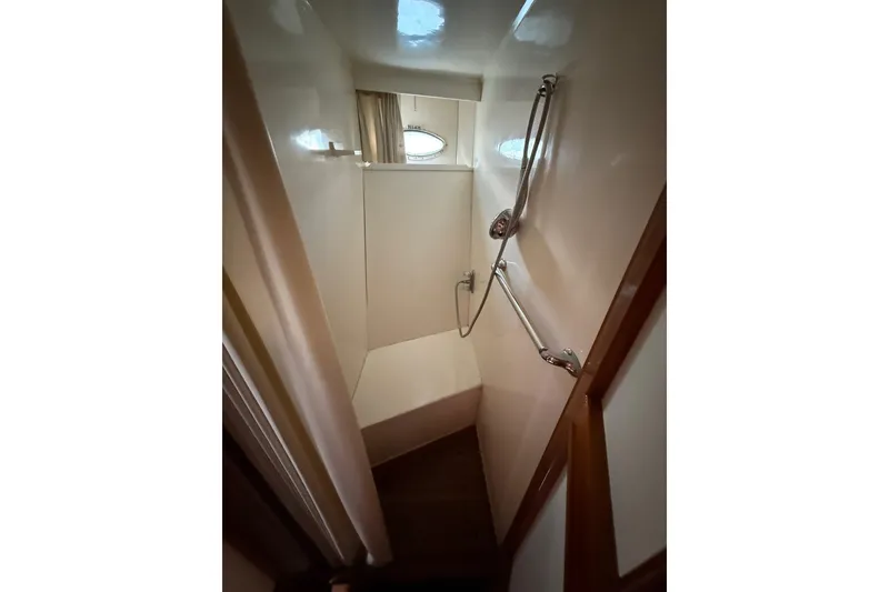 Slide: The Image of Compact shower area in 1989 Jefferson Marquessa 52 yacht with handheld showerhead. - 19