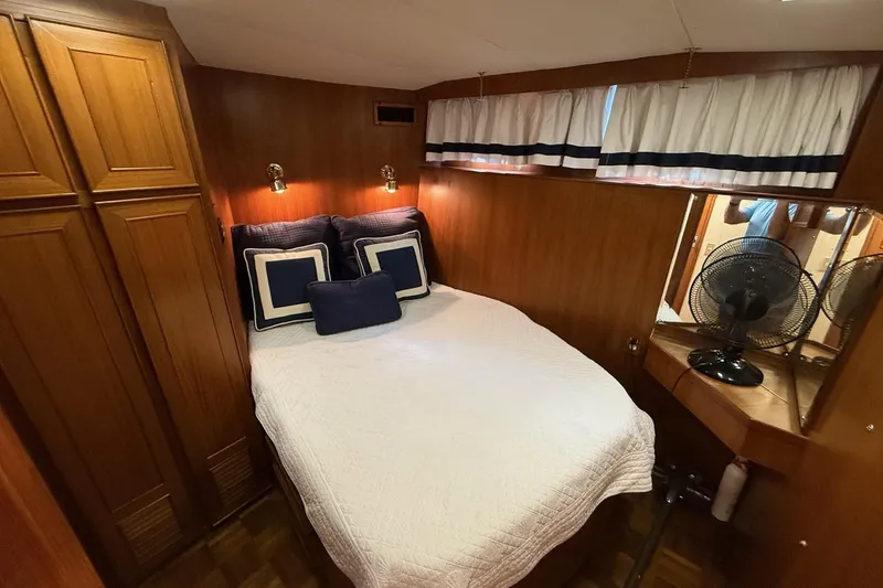 Slide: The Image of Cozy bedroom in 1989 Jefferson Marquessa 52 yacht with wood paneling and nautical decor. - 21