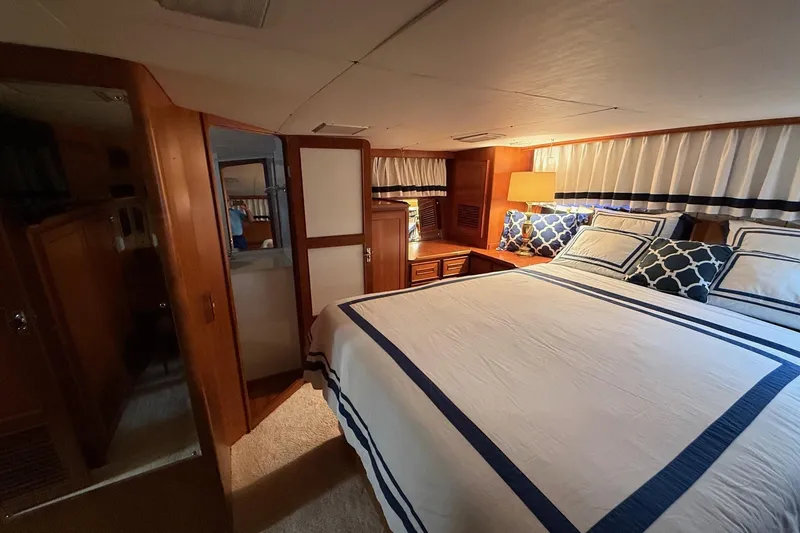 Slide: The Image of Luxurious bedroom interior of 1989 Jefferson Marquessa 52 yacht with elegant bedding. - 24