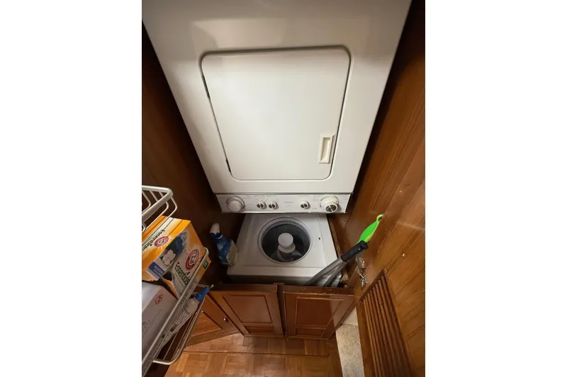 Slide: The Image of Stacked washer and dryer in 1989 Jefferson Marquessa 52 yacht laundry area. - 27
