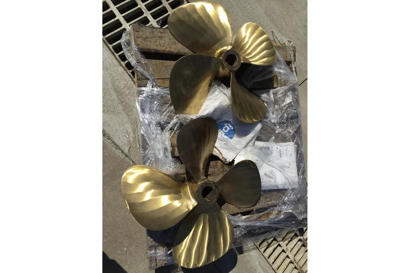 Slide: The Image of Brass propellers for 1989 Jefferson Marquessa 52 yacht on wooden pallet. - 28