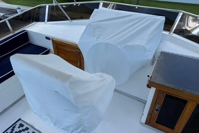 Slide: The Image of 1989 Jefferson Marquessa 52 yacht deck with covered controls and seating area. - 3