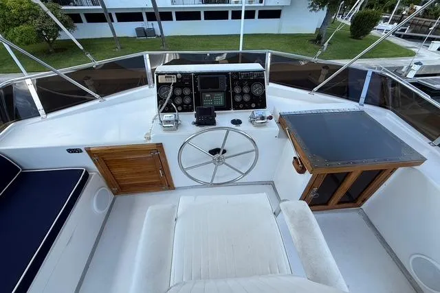 Slide: The Image of 1989 Jefferson Marquessa 52 yacht helm with steering wheel and navigation instruments. - 4