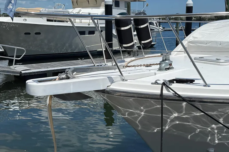 Slide: The Image of 1989 Jefferson Marquessa 52 yacht docked, featuring anchor and deck details. - 8