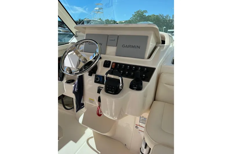 Slide: The Image of 2020 Grady-White Express 330 helm with Garmin navigation system and controls. - 10