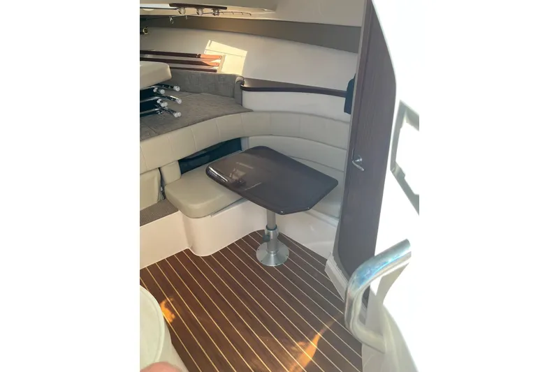 Slide: The Image of 2020 Grady-White Express 330 cabin interior with seating and table. - 16
