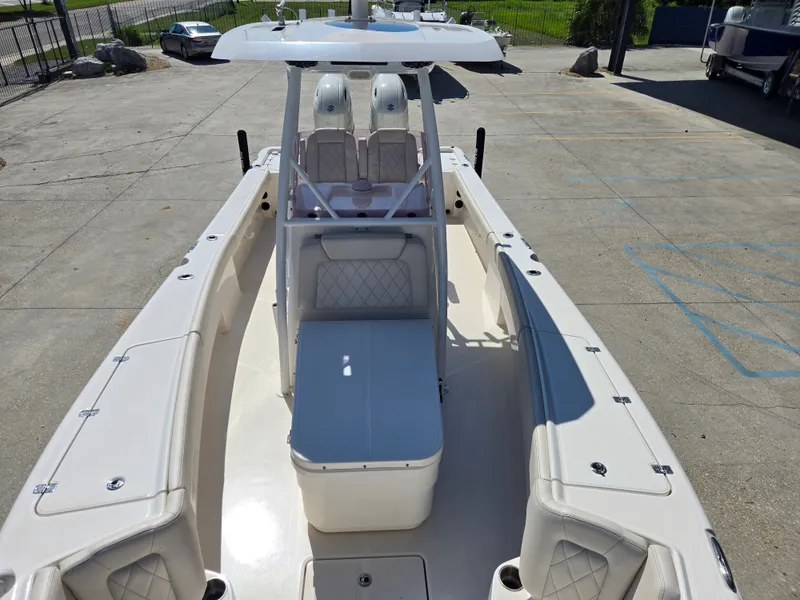 Slide: The Image of Open storage compartment on 2021 Blue Wave 2800 Makaira boat deck. - 12