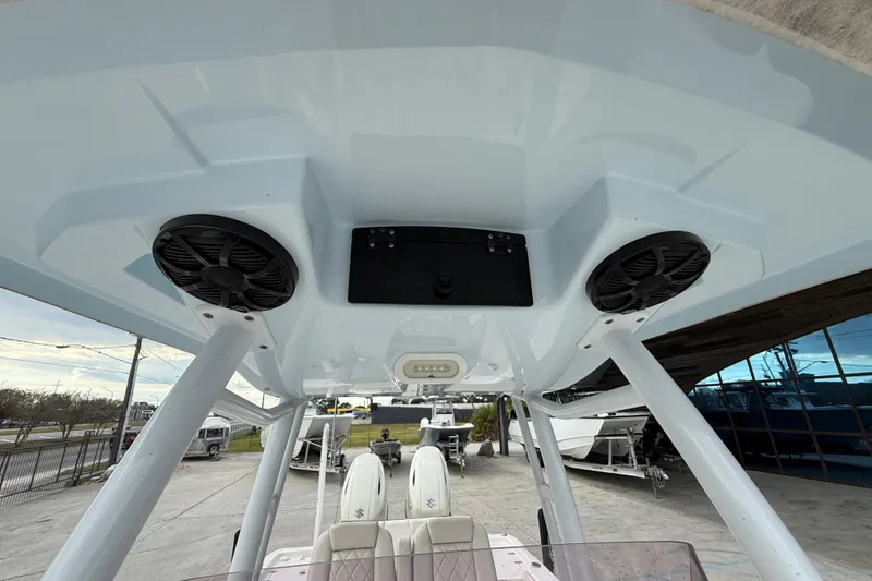 Slide: The Image of 2021 Blue Wave 2800 Makaira boat with dual speakers on the overhead console. - 19