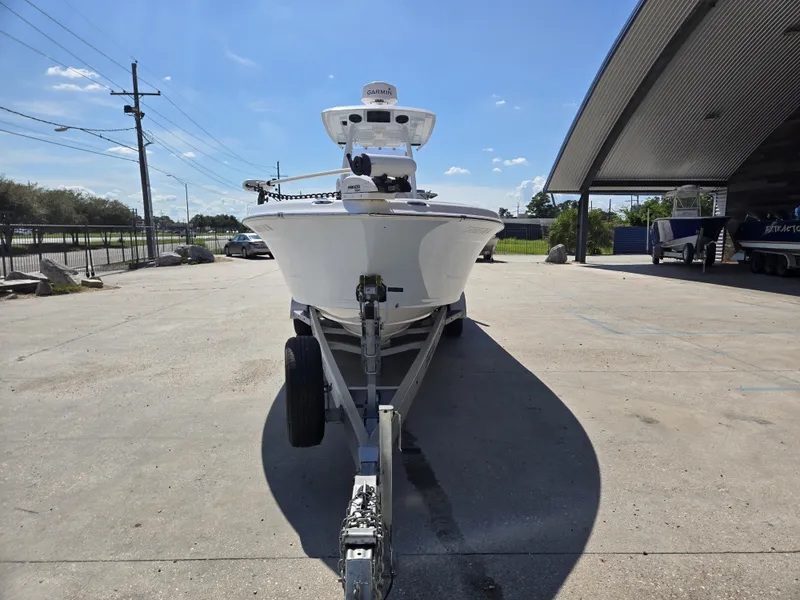 Slide: The Image of 2021 Blue Wave 2800 Makaira boat on trailer, featuring Minn Kota Terrova motor. - 2