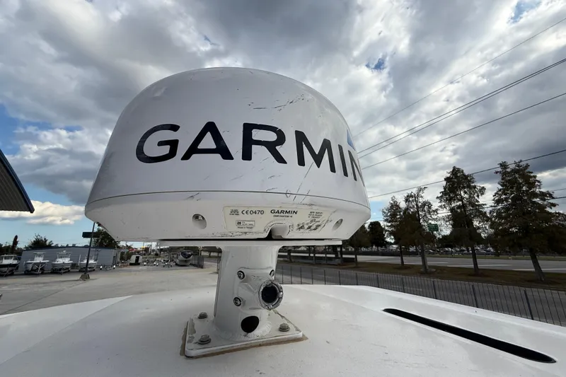 Slide: The Image of Garmin radar on 2021 Blue Wave 2800 Makaira boat under cloudy sky. - 20