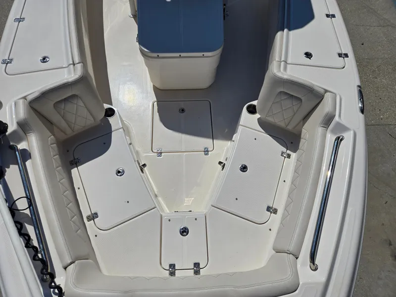 Slide: The Image of 2021 Blue Wave 2800 Makaira boat with dual Suzuki outboard motors on a trailer. - 6