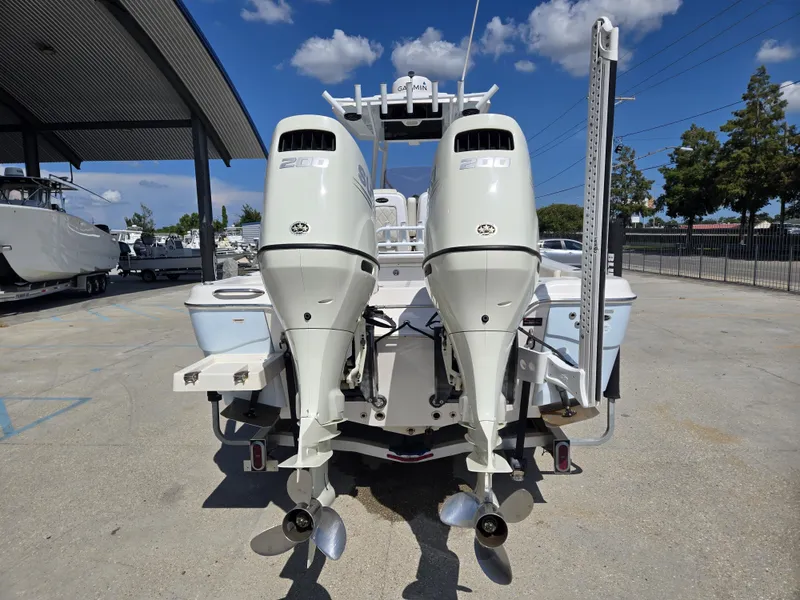 Slide: The Image of 2021 Blue Wave 2800 Makaira boat interior with steering console and seating. - 8