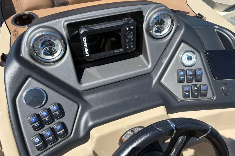 Slide: The Image of 2024 Sylvan L3 CLZ boat dashboard with gauges, Lowrance display, and control buttons. - 12