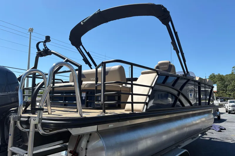 Slide: The Image of 2024 Sylvan L3 CLZ pontoon boat with sleek design and modern features. - 2