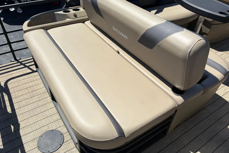 Slide: The Image of 2024 Sylvan L3 CLZ boat seat with beige upholstery and cup holders. - 23