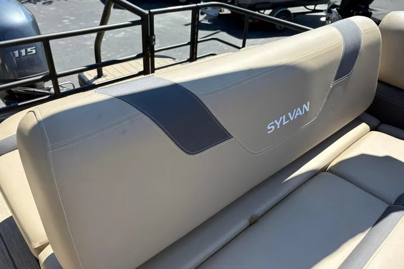 Slide: The Image of 2024 Sylvan L3 CLZ boat seat with logo, featuring beige upholstery and sleek design. - 25