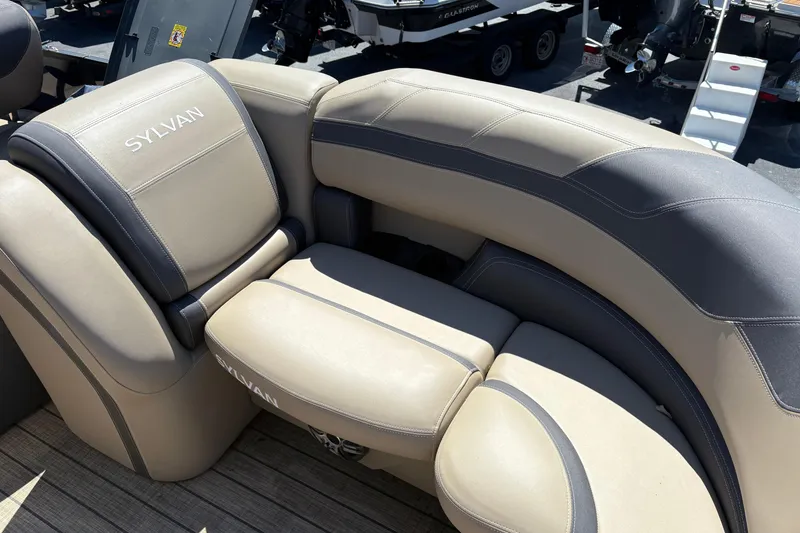 Slide: The Image of 2024 Sylvan L3 CLZ boat seating with beige and gray upholstery. - 6