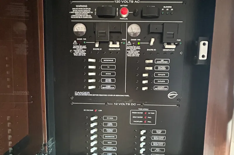 Slide: The Image of Electrical control panel of a 2015 Crownline 350 SY boat, featuring switches and indicators. - 10