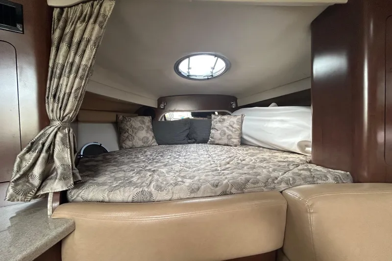 Slide: The Image of Luxurious cabin interior of 2015 Crownline 350 SY yacht with cozy bedding. - 16