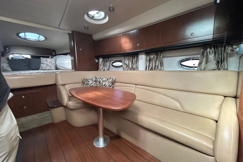 Slide: The Image of Luxurious interior of 2015 Crownline 350 SY yacht with elegant seating and wooden table. - 23