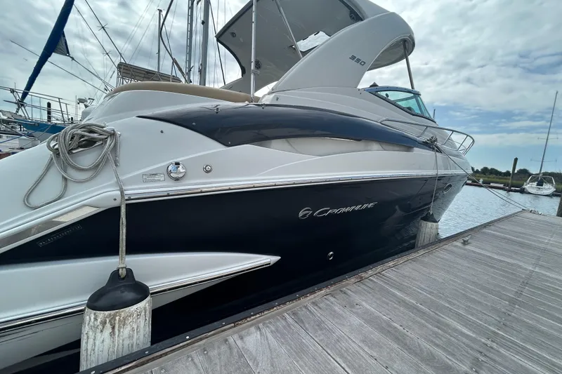 Slide: The Image of 2015 Crownline 350 SY yacht docked at marina, showcasing sleek design and modern features. - 40