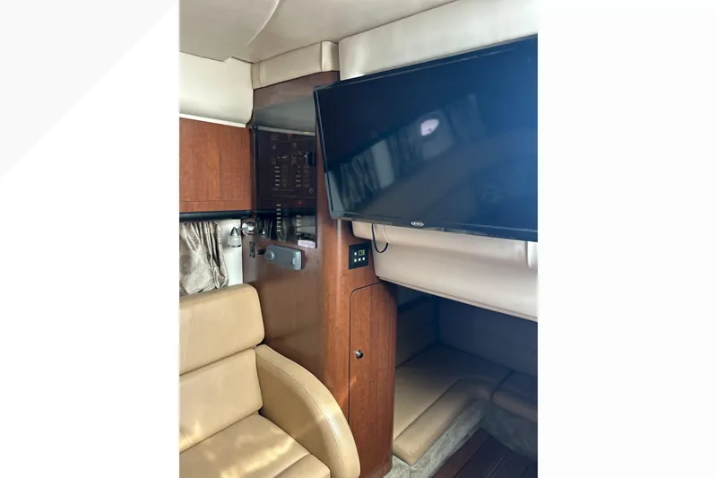 Slide: The Image of Interior of 2015 Crownline 350 SY yacht with TV and seating area. - 57