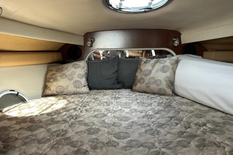 Slide: The Image of Luxurious interior cabin of 2015 Crownline 350 SY yacht with plush bedding and pillows. - 62