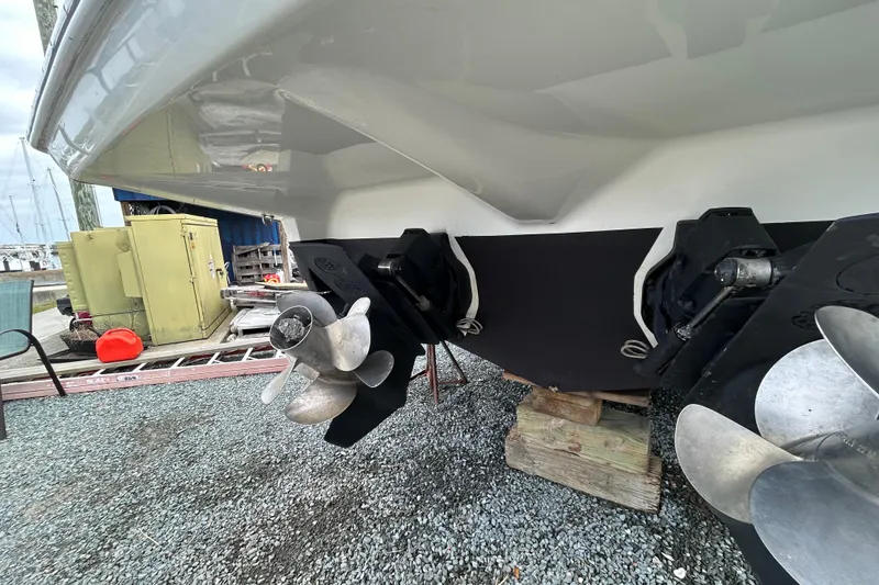 Slide: The Image of 2015 Crownline 350 SY boat propellers and stern view at a marina. - 66