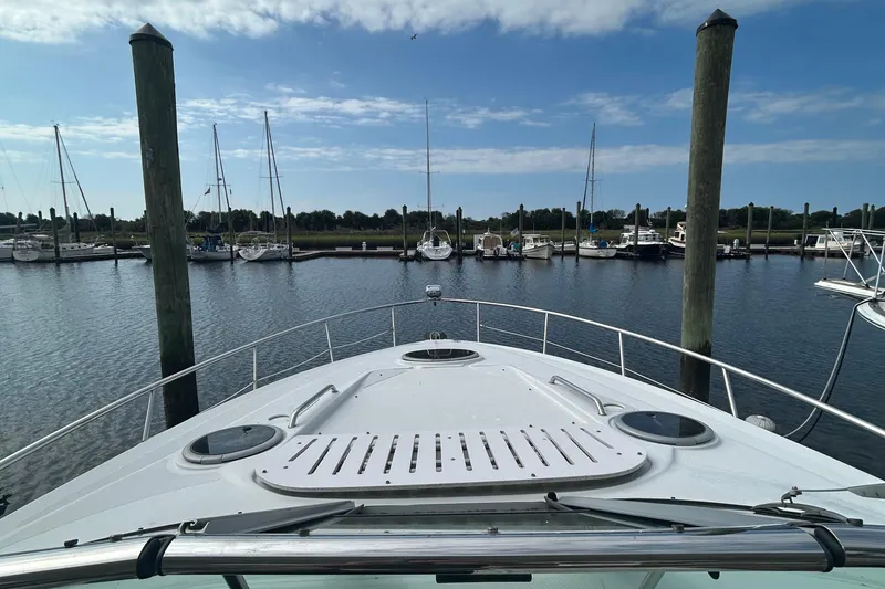 Slide: The Image of Bow view of 2015 Crownline 350 SY yacht docked at marina. - 8