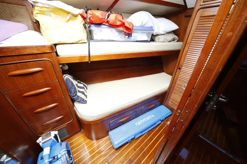 Slide: The Image of Cozy cabin interior of 1981 Gulfstar 60 CC yacht with wooden furnishings and bunk beds. - 10
