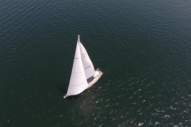 Slide: The Image of Aerial view of 1981 Gulfstar 60 CC sailboat navigating open waters. - 28