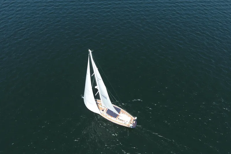 Slide: The Image of Aerial view of 1981 Gulfstar 60 CC sailboat navigating open waters. - 29