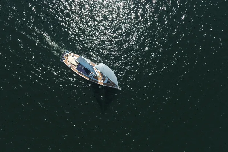 Slide: The Image of Aerial view of 1981 Gulfstar 60 CC sailboat navigating through shimmering water. - 3