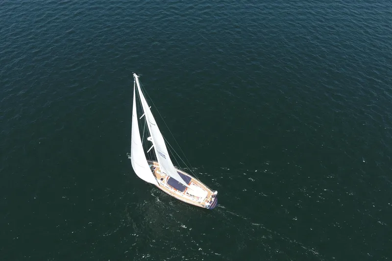 Slide: The Image of Aerial view of 1981 Gulfstar 60 CC sailboat navigating open sea. - 30