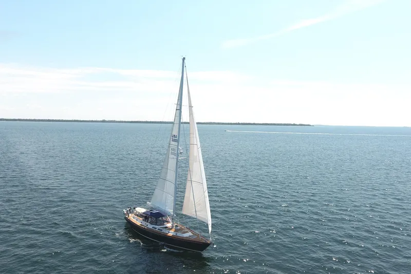 Slide: The Image of Sailing yacht Gulfstar 60 CC from 1981 on open water under clear skies. - 35