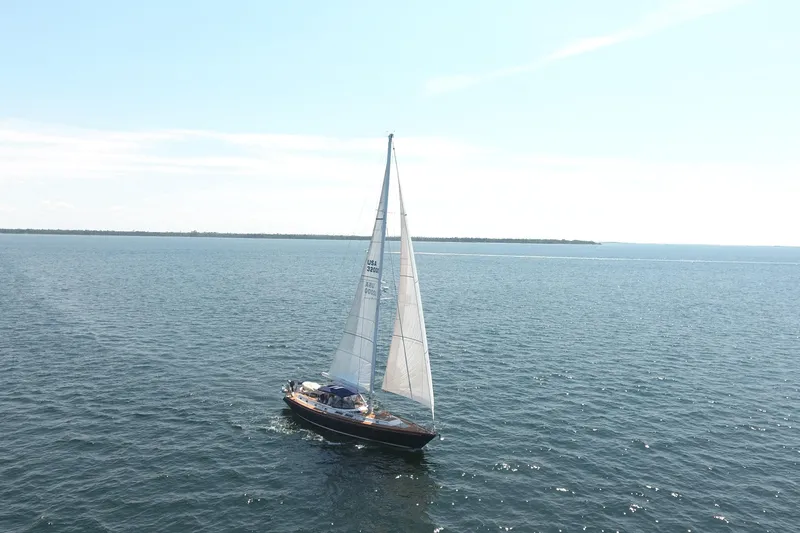 Slide: The Image of Sailing yacht Gulfstar 60 CC, 1981 model, cruising on open water under clear skies. - 36