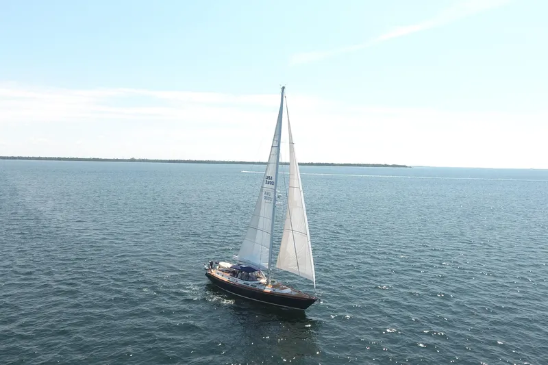 Slide: The Image of Sailing yacht Gulfstar 60 CC, 1981 model, cruising on open water under clear skies. - 37