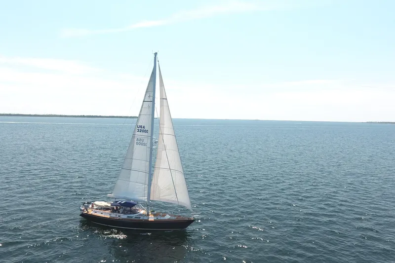 Slide: The Image of Sailing yacht Gulfstar 60 CC, 1981 model, cruising on open sea under clear skies. - 38