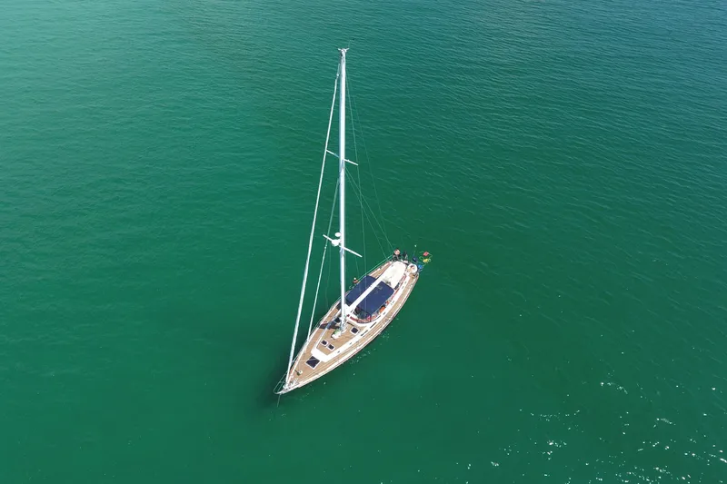 Slide: The Image of Aerial view of 1981 Gulfstar 60 CC sailboat on calm green water. - 40