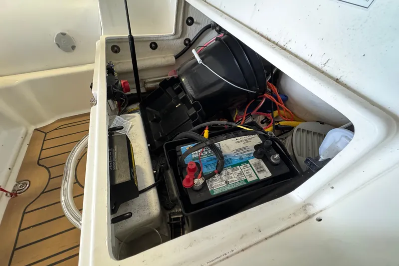 Slide: The Image of 2019 Zodiac Yachtline 400 battery compartment with wiring and equipment. - 10
