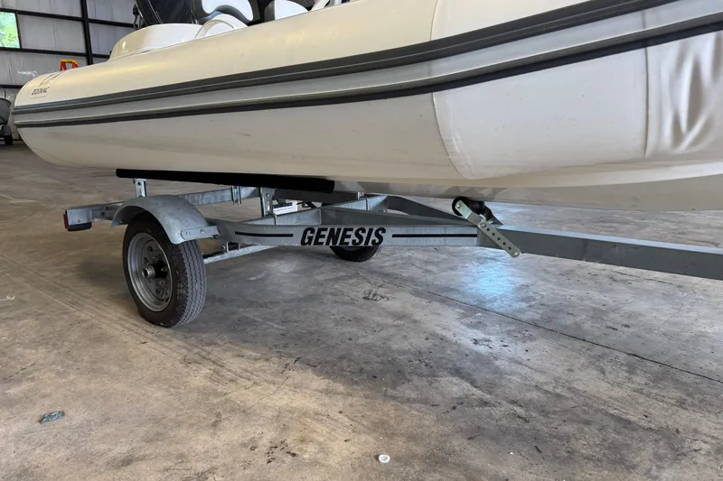 Slide: The Image of 2019 Zodiac Yachtline 400 on Genesis trailer in a warehouse setting. - 14