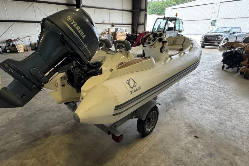 Slide: The Image of 2019 Zodiac Yachtline 400 inflatable boat with Yamaha outboard motor in a warehouse. - 4