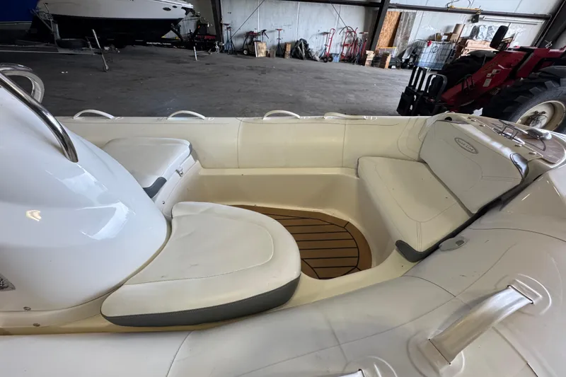 Slide: The Image of 2019 Zodiac Yachtline 400 interior with white seating and wooden floor detail. - 6
