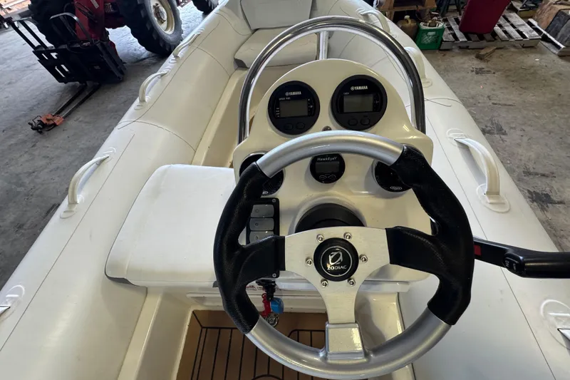 Slide: The Image of 2019 Zodiac Yachtline 400 boat interior with steering wheel and control panel. - 7