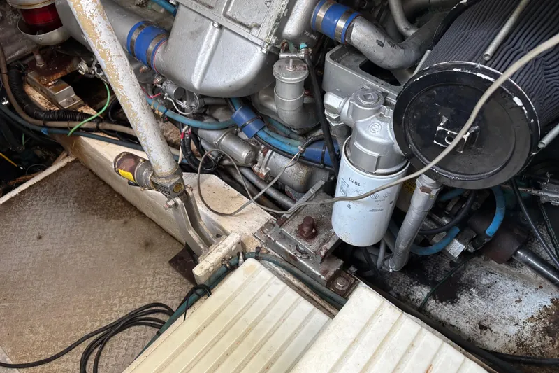 Slide: The Image of Engine compartment of a 1991 Trojan 12 Meter Express 400 boat, showing mechanical components. - 13