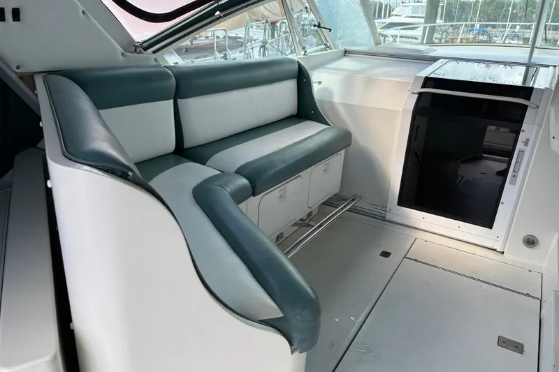 Slide: The Image of Interior of a 1991 Trojan 12 Meter Express 400 yacht with seating and storage. - 16