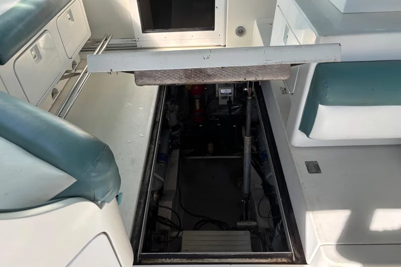 Slide: The Image of 1991 Trojan 12 Meter Express 400 engine compartment with open hatch, revealing interior components. - 2