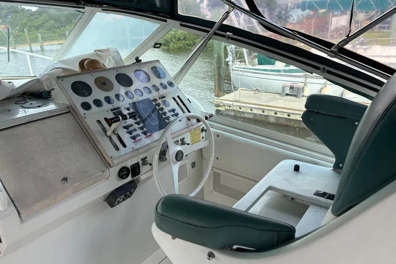 Slide: The Image of Cockpit of 1991 Trojan 12 Meter Express 400 yacht with control panel and steering wheel. - 6
