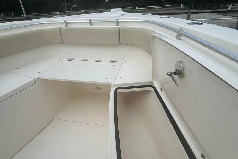 Slide: The Image of 2016 Cobia 296 Center Console boat interior with seating and storage compartments. - 15